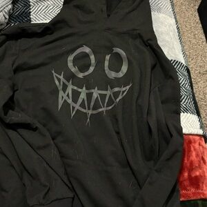 Black Hoodie with Smiling Face Design